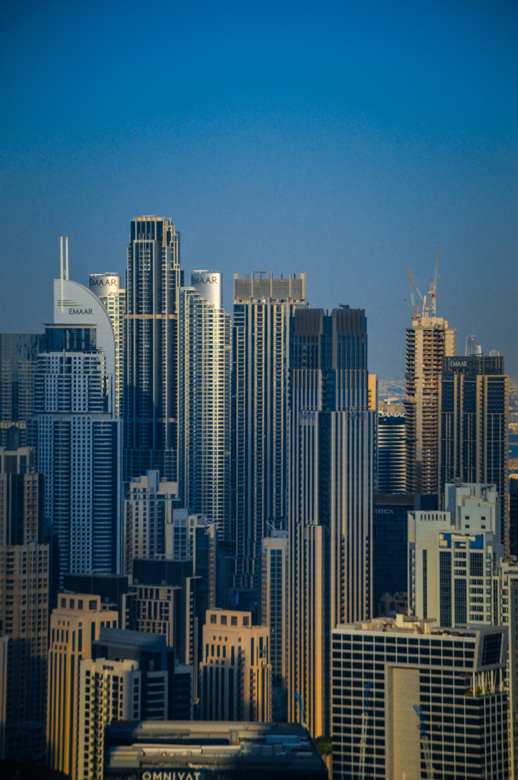 Stunning view of Dubai's iconic skyscrapers under a clear blue sky.